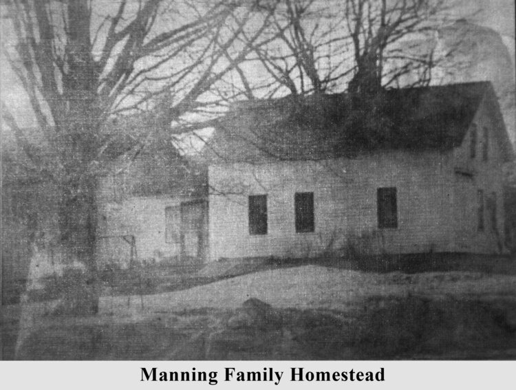 A black and white newspaper photo showing a colonial-style white house